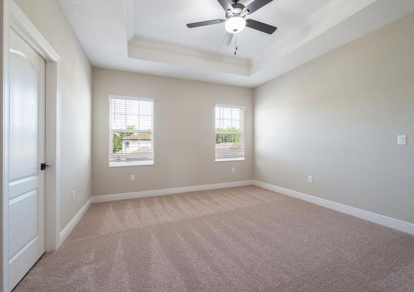 The master bedroom includes two big windows for plenty of natural light.