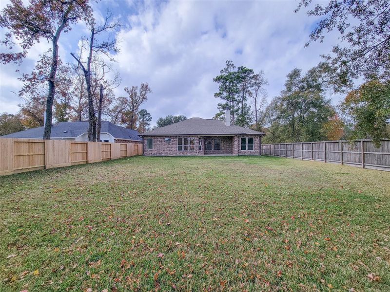 Exterior details and patio area of a home in , Conroe (Image 28).