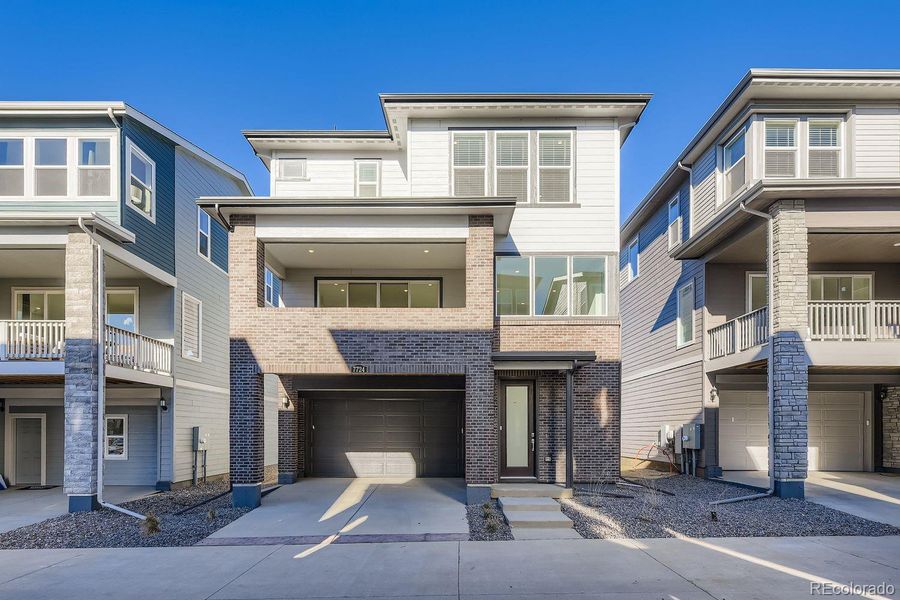 Front exterior of a new home in Vermilion Creek: The Skyline Collection, Centennial, CO, highlighting curb appeal (Image 14).