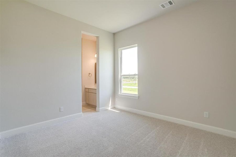 Spare room with light colored carpet