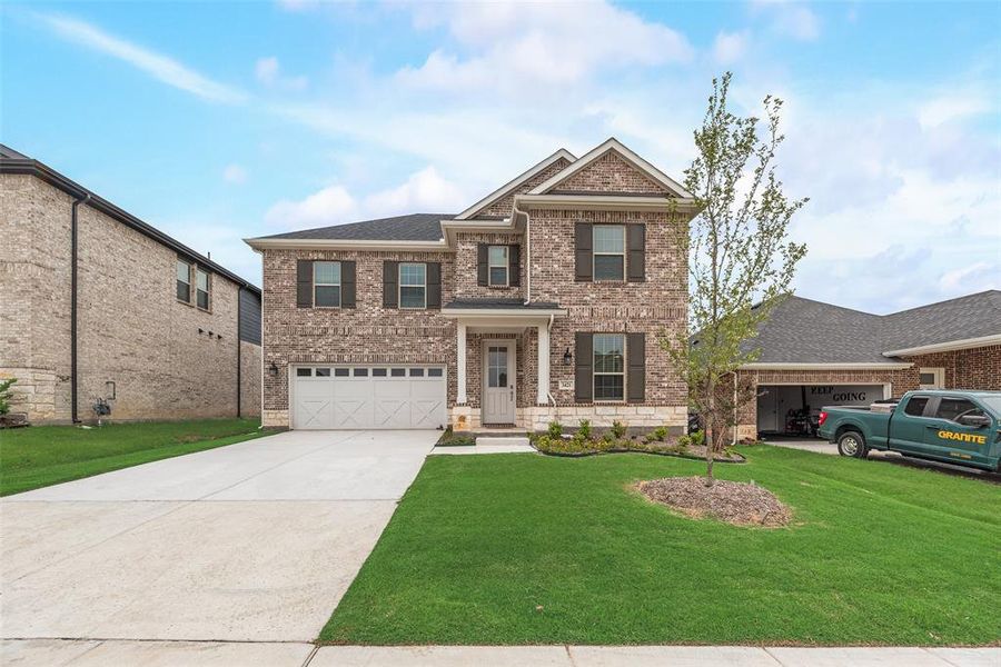 Front exterior of a new home in Villages of Hurricane Creek, Anna, TX, highlighting curb appeal (Image 1).