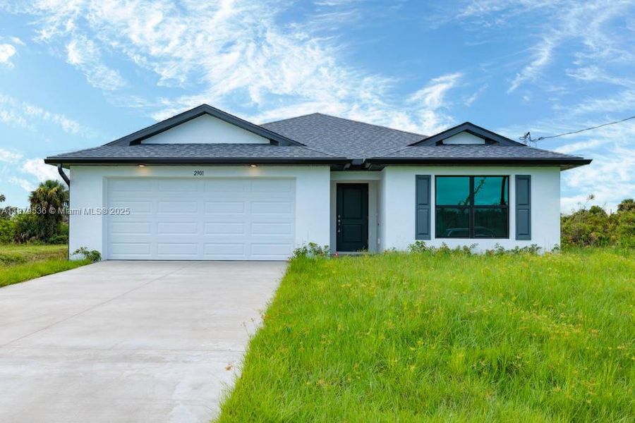 Front exterior of a new home in , Lehigh Acres, FL, highlighting curb appeal (Image 2). Front exterior of a new home in , Lehigh Acres, FL, highlighting curb appeal (Image 2).