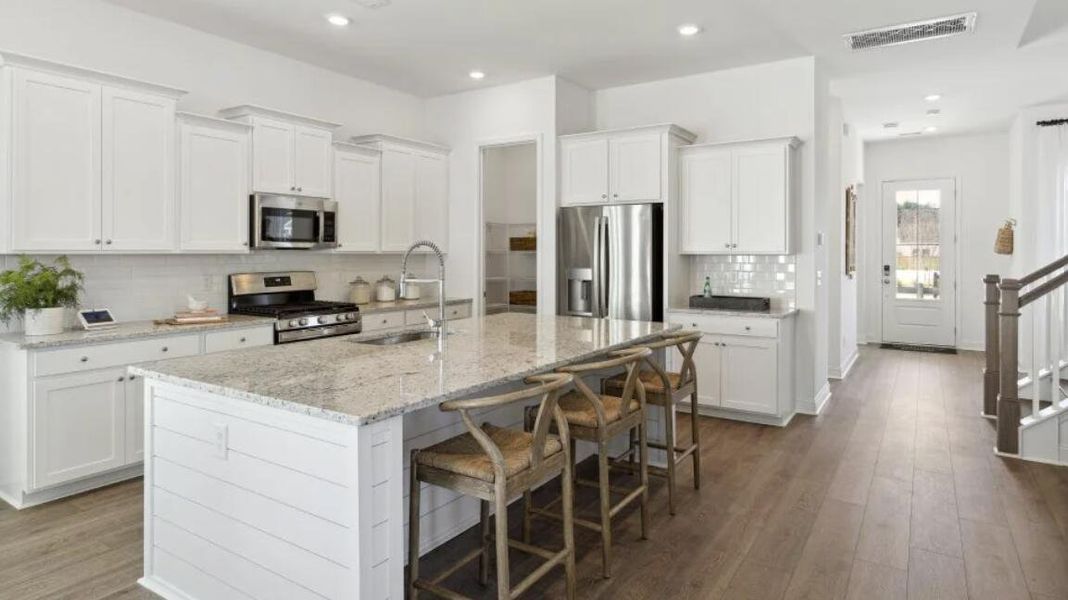 Furnished interior view inside a new home in Carnes Crossroads: Row Collection, Summerville (Image 10). Furnished interior view inside a new home in Carnes Crossroads: Row Collection, Summerville (Image 10).