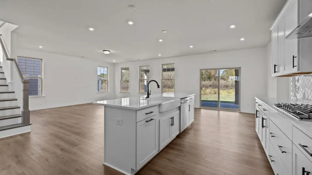 Norris Design gourmet kitchen island and convenient open concept. At Lakeside Glen by premier builder DRB Homes in York, SC. Norris Design gourmet kitchen island and convenient open concept. At Lakeside Glen by premier builder DRB Homes in York, SC.