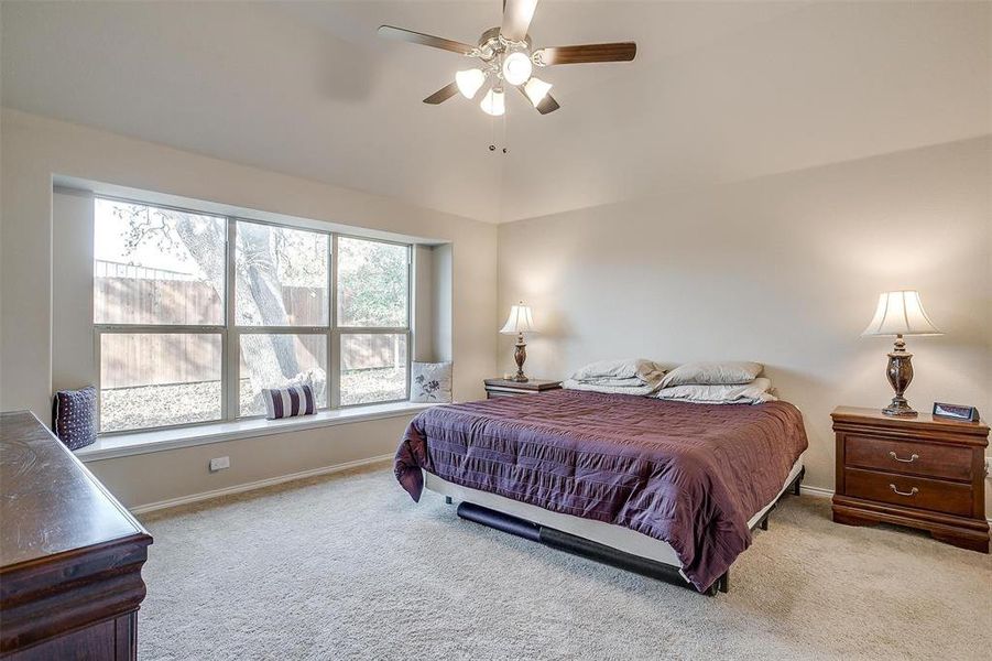 Bedroom with light carpet and ceiling fan