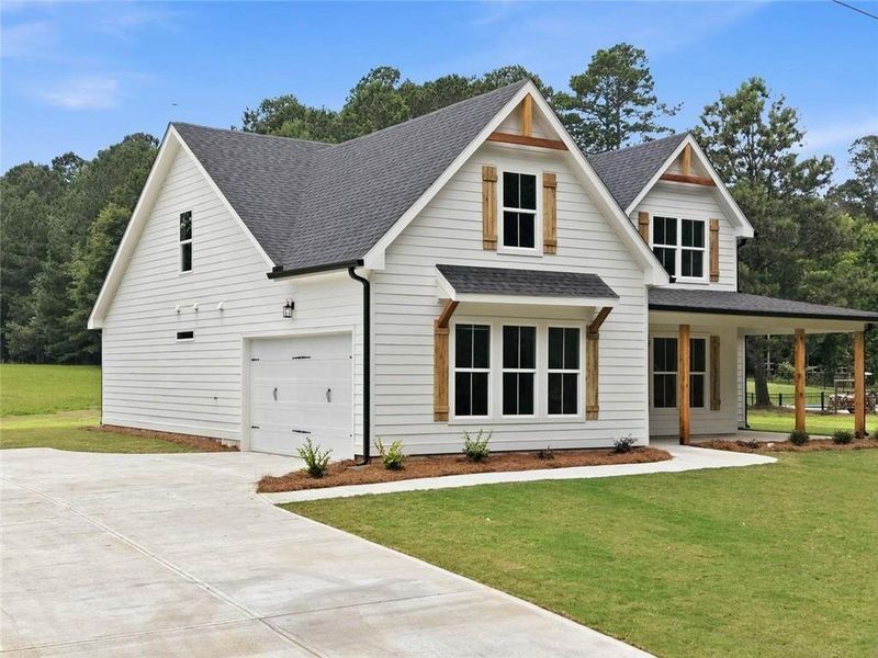 Front exterior of a new home in , Mansfield, GA, highlighting curb appeal (Image 32). Front exterior of a new home in , Mansfield, GA, highlighting curb appeal (Image 32).