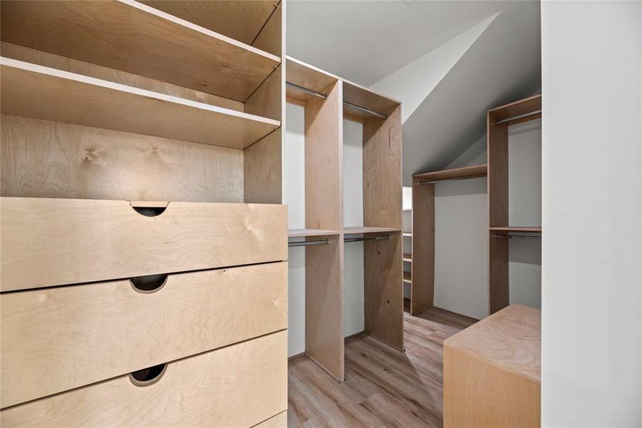 The primary walk-in closet with so much custom built-ins. Every space is used perfectly.