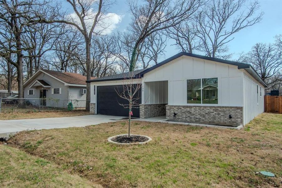 Front exterior of a new home in , Gun Barrel City, TX, highlighting curb appeal (Image 25).