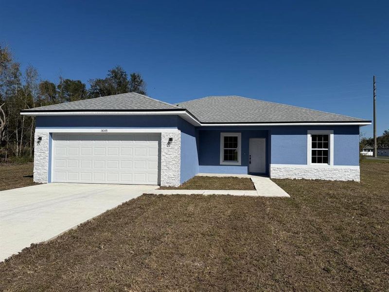 Front exterior of a new home in , Ocala, FL, highlighting curb appeal (Image 14).