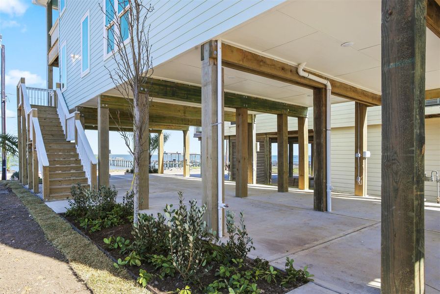 Beautiful landscaping and extra space underneath the home Beautiful landscaping and extra space underneath the home