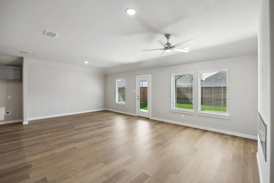 Living and Dining in the Emmy II home plan by Trophy Signature Homes - REPRESENTATIVE PHOTO