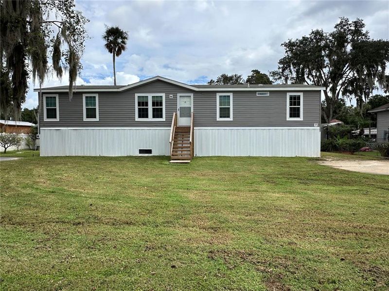 Front exterior of a new home in , Astor, FL, highlighting curb appeal (Image 24). Front exterior of a new home in , Astor, FL, highlighting curb appeal (Image 24).