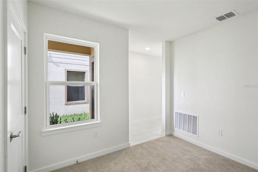 Spacious, unfurnished interior of a new home in Grasslands West, Lakeland (Image 26).