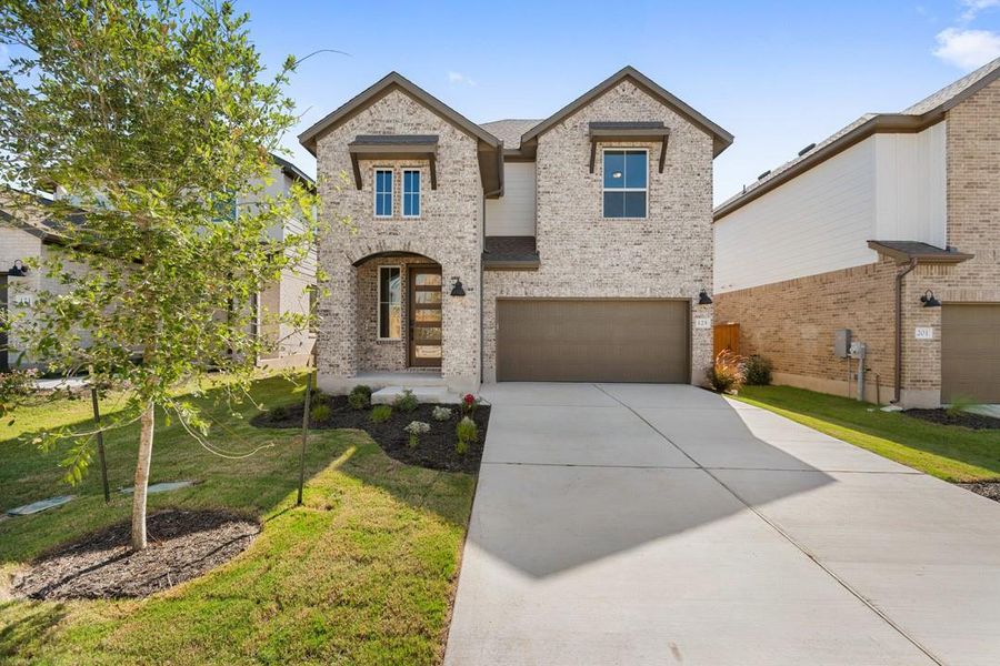 Front exterior of a new home in Terrace Collection at Lariat, Liberty Hill, TX, highlighting curb appeal (Image 18). Front exterior of a new home in Terrace Collection at Lariat, Liberty Hill, TX, highlighting curb appeal (Image 18).