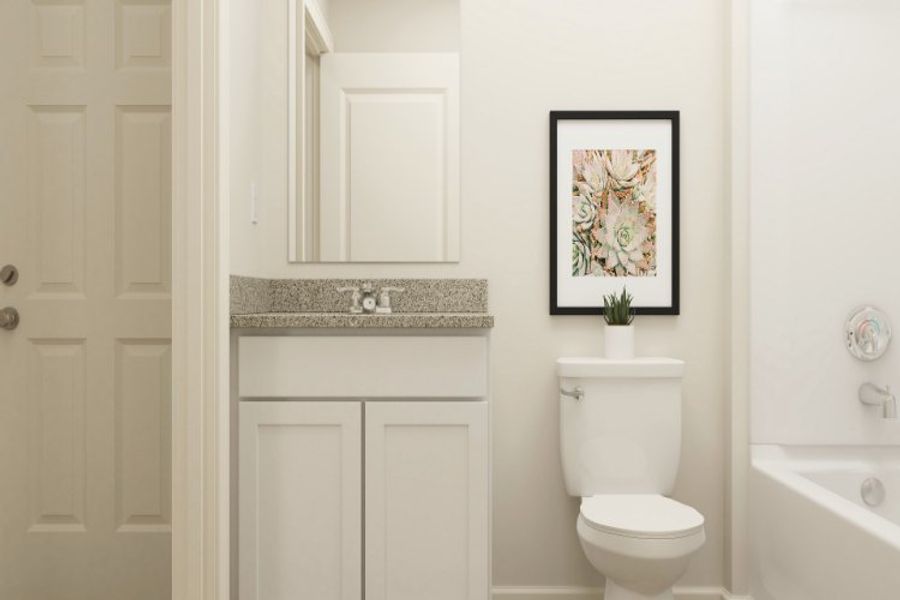 A bathroom with a toilet and a sink.