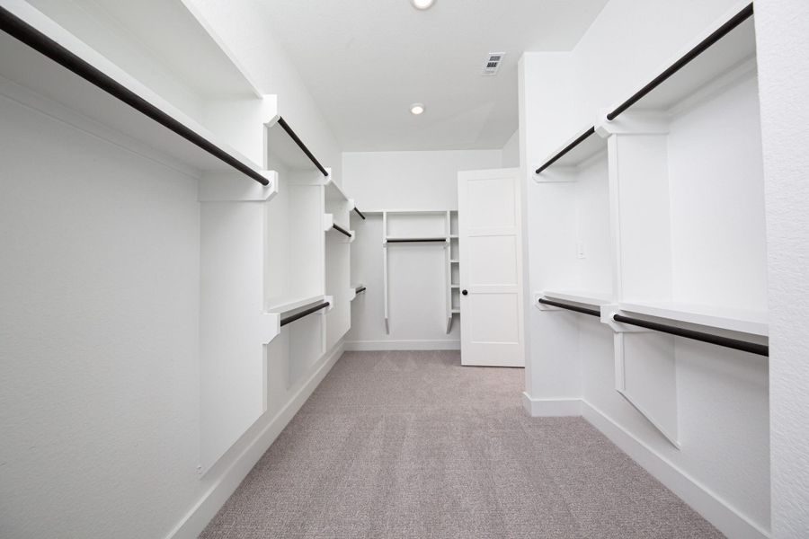 Look at this immaculate closet! With high shelving, multiple rows to hang clothing, you are sure to have enough room for all your belongings!