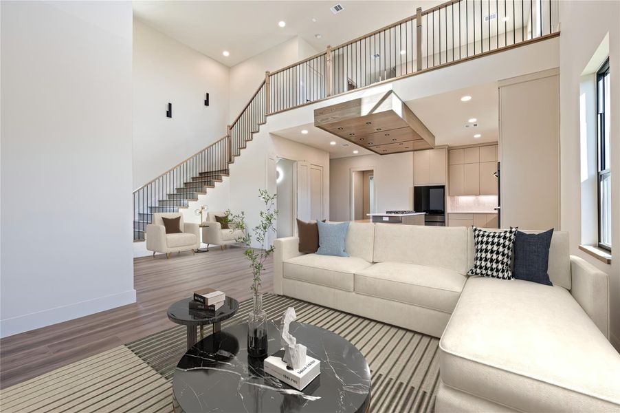Soaring ceilings in this living room with natural lighting and ample seating (virtually staged)
