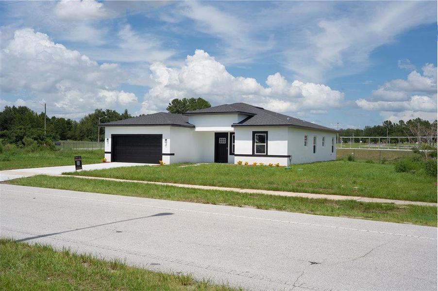 Front exterior of a new home in , Ocala, FL, highlighting curb appeal (Image 2).