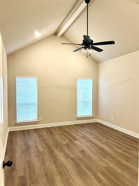 Spare room with wood finished floors, a ceiling fan, and baseboards Spare room with wood finished floors, a ceiling fan, and baseboards