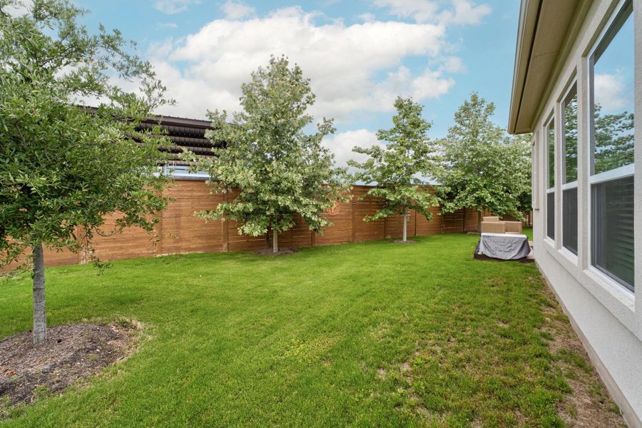 View of yard with fence View of yard with fence