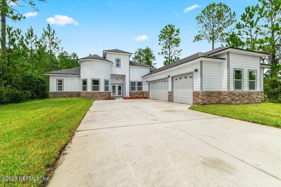 Front exterior of a new home in , Jacksonville, FL, highlighting curb appeal (Image 19).