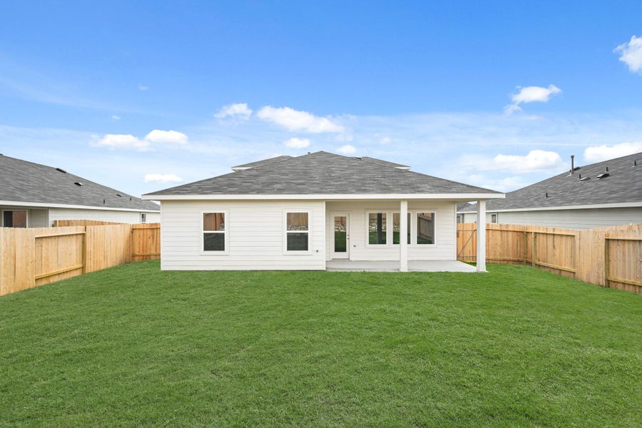 Exterior details and patio area of a home in Grand Pines, Magnolia (Image 14).