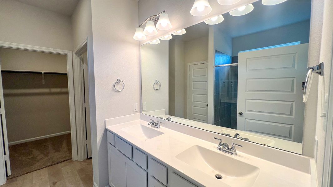 The Sparrow II- Primary Bathroom with dual vanities. Sample floor plan image for illustration; upgrades, options, and colors may vary.