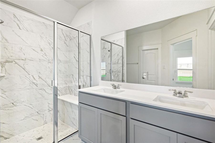 Bathroom featuring vanity and walk in shower