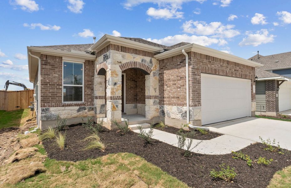Front exterior of a new home in Patterson Ranch, Georgetown, TX, highlighting curb appeal (Image 18).