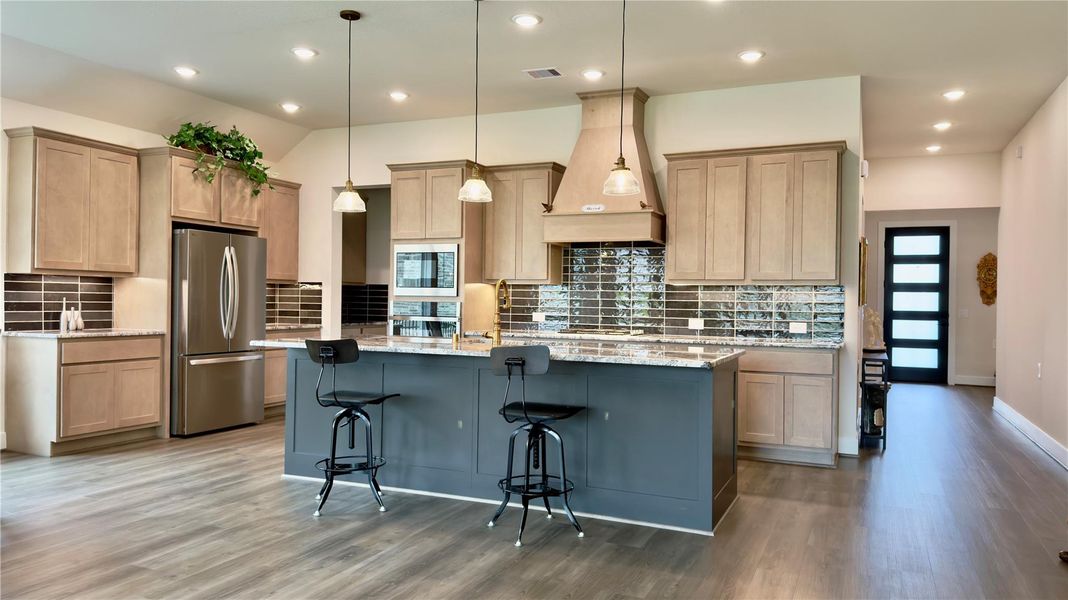 Another view of the lovely kitchen with brushed gold tone accents