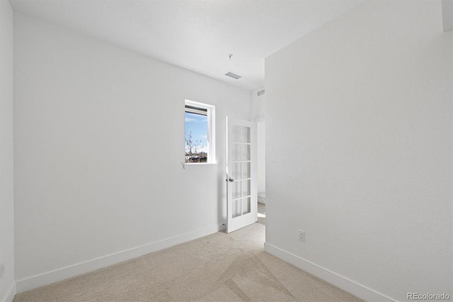 Versatile lower-level room ideal for a home office, study, den, or flex space to fit your lifestyle needs. Versatile lower-level room ideal for a home office, study, den, or flex space to fit your lifestyle needs.