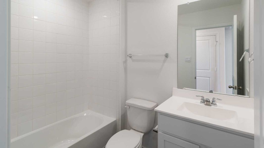 Representative furnished interior of a home built from the The Dahlia by D.R. Horton in Marigold, Kyle (Image 6).