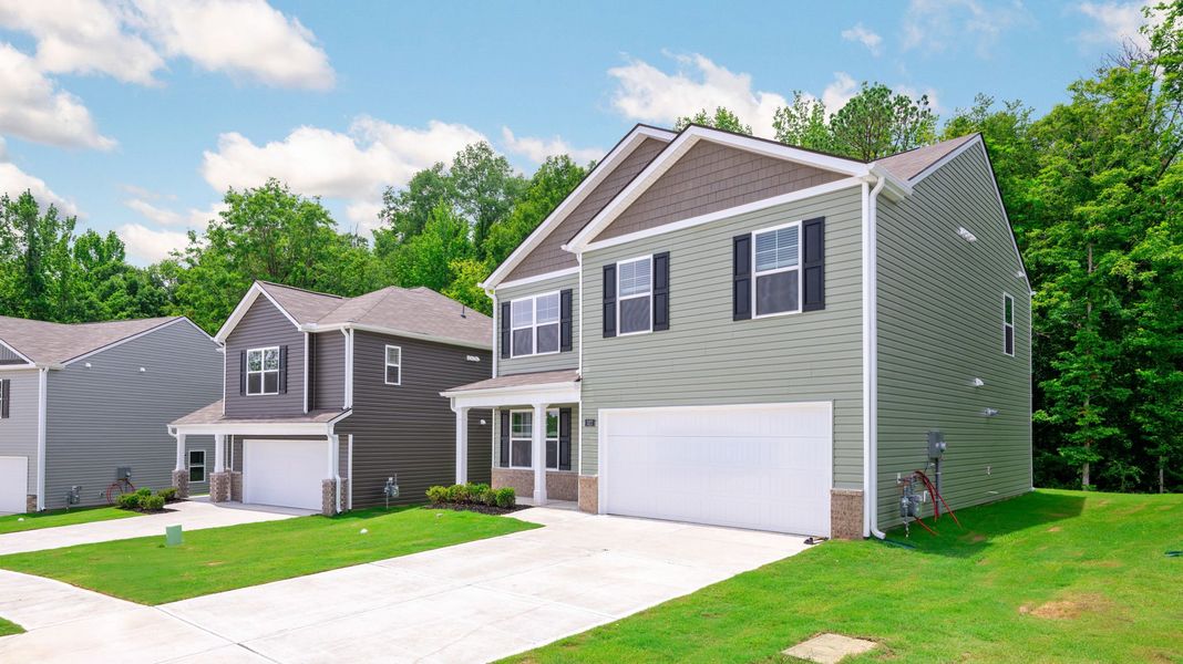 Front exterior of a new home in Price's Crossing, LaFayette, GA, highlighting curb appeal (Image 19). Front exterior of a new home in Price's Crossing, LaFayette, GA, highlighting curb appeal (Image 19).