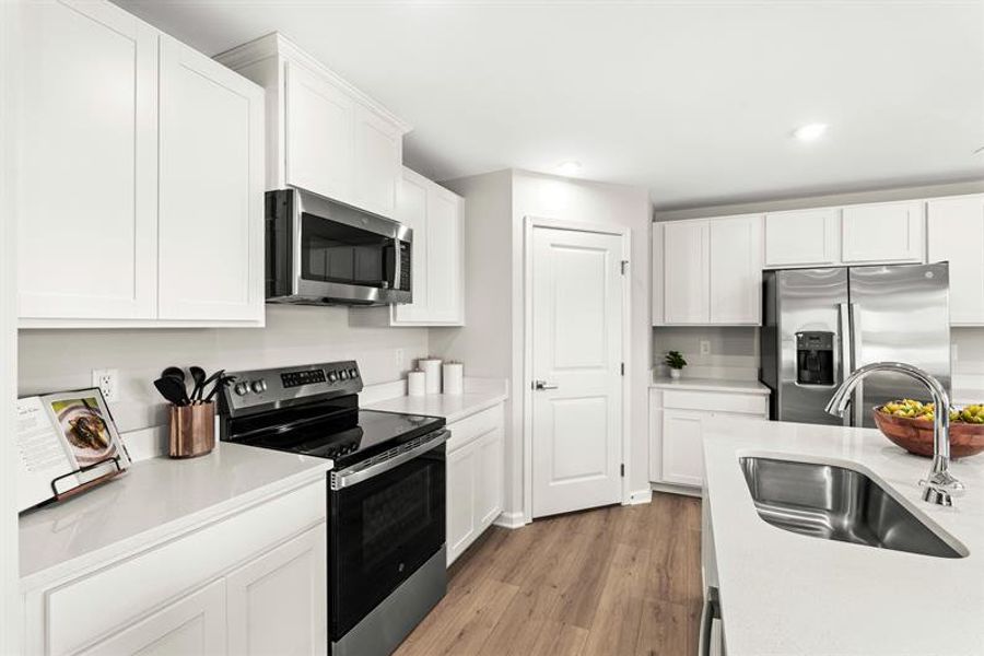Representative furnished interior of a home built from the Woodford by Ryan Homes in Oakwood Trace, Fairburn (Image 8).