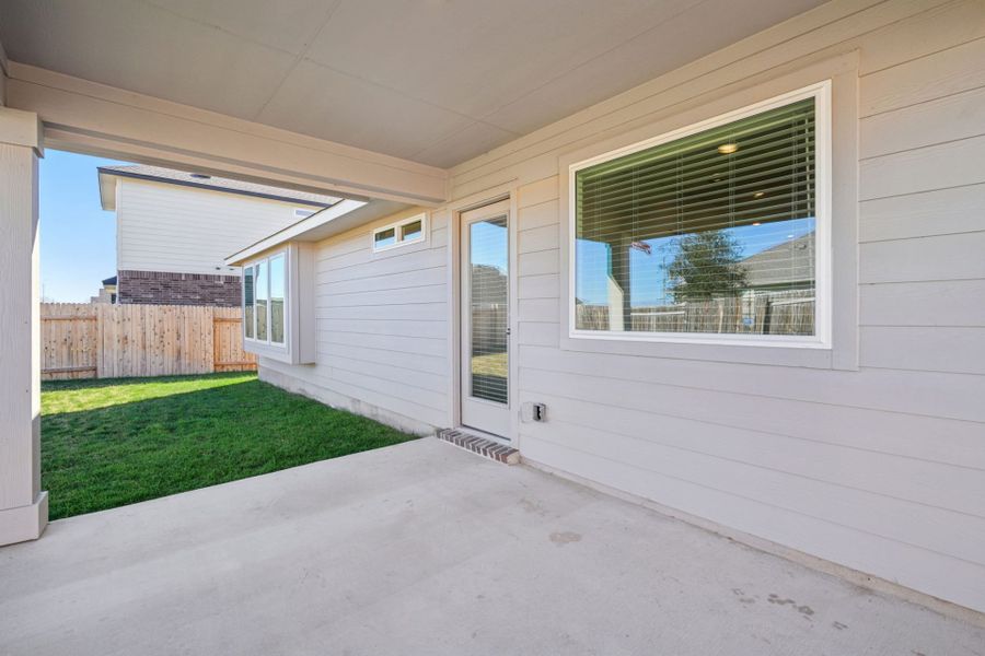 Exterior details and patio area of a home in Village at Three Oaks, Seguin (Image 17).