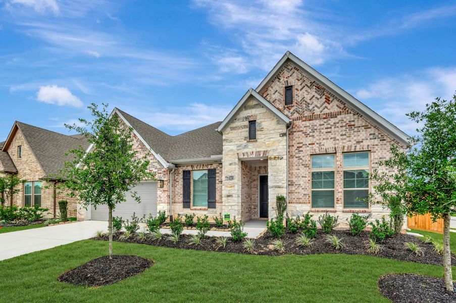 Front exterior of a new home in Escondido - Overlook Collection, Magnolia, TX, highlighting curb appeal (Image 2). Front exterior of a new home in Escondido - Overlook Collection, Magnolia, TX, highlighting curb appeal (Image 2).