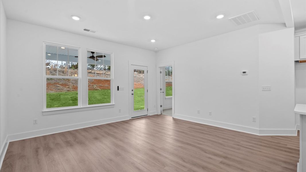 Hardwood flooring and high standards define this vibrant family room ideal for everyday living located in Moore, SC