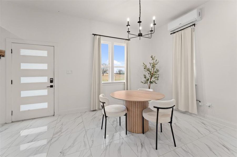 Bright interior space featuring white walls and marble-look tile flooring Bright interior space featuring white walls and marble-look tile flooring