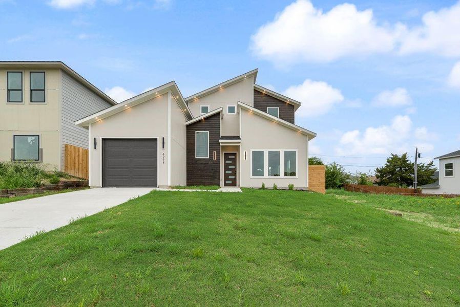 Front exterior of a new home in , Dallas, TX, highlighting curb appeal (Image 19).