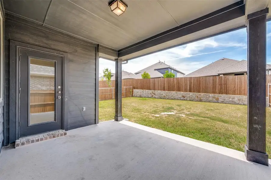 Exterior details and patio area of a home in The Villages of Hurricane Creek, Anna (Image 4).