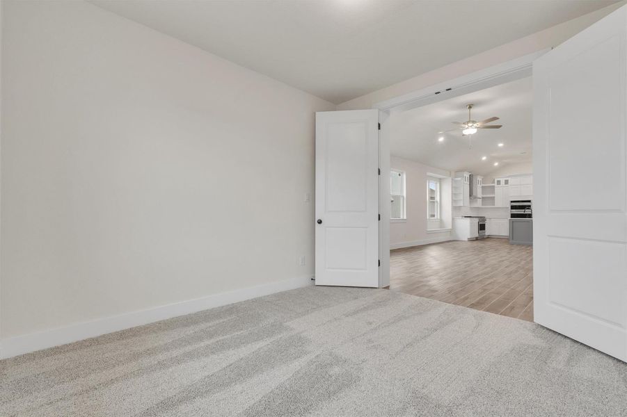 Flexible living space offering a quiet retreat or an open connection to the vibrant kitchen beyond.