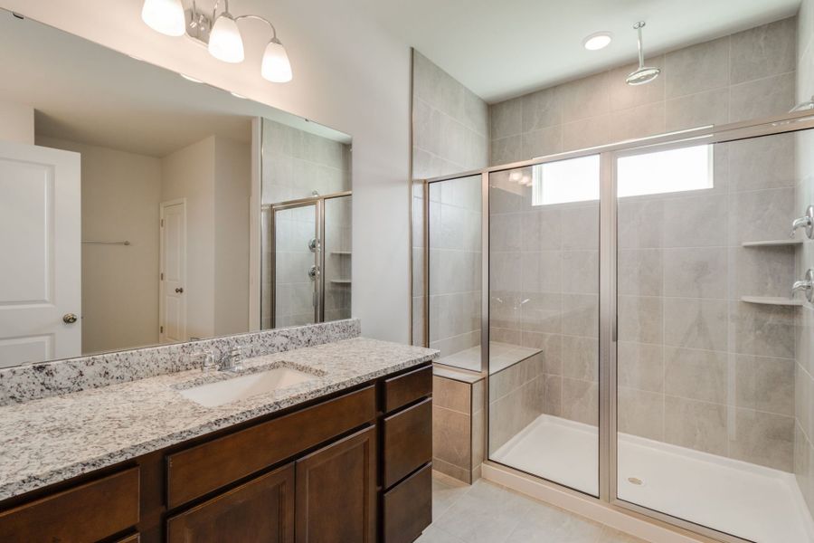Owner's bath with a frameless walk-in shower