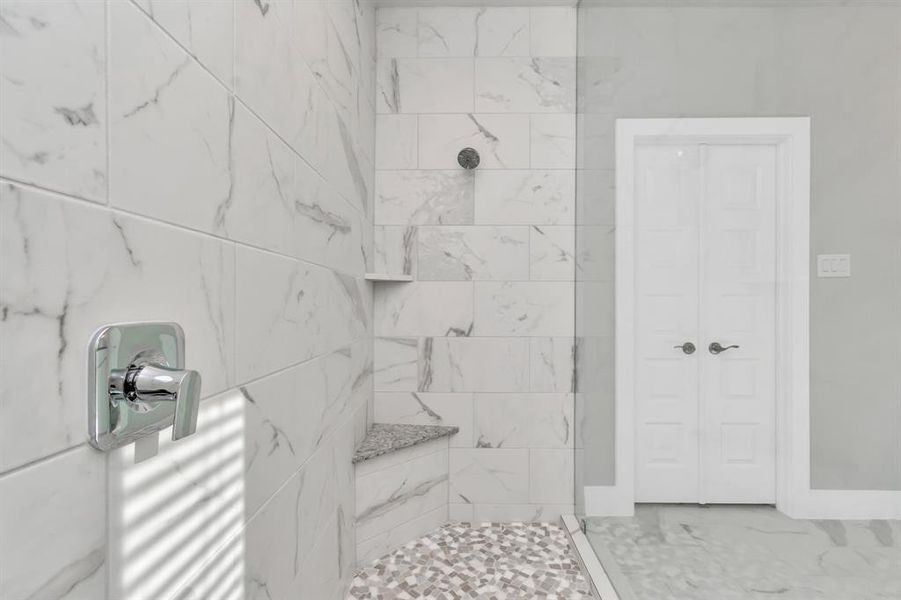 Sleek modern hardware throughout the primary bath. Sample photo of completed home with similar floor plan. As-built interior colors and selections may vary.