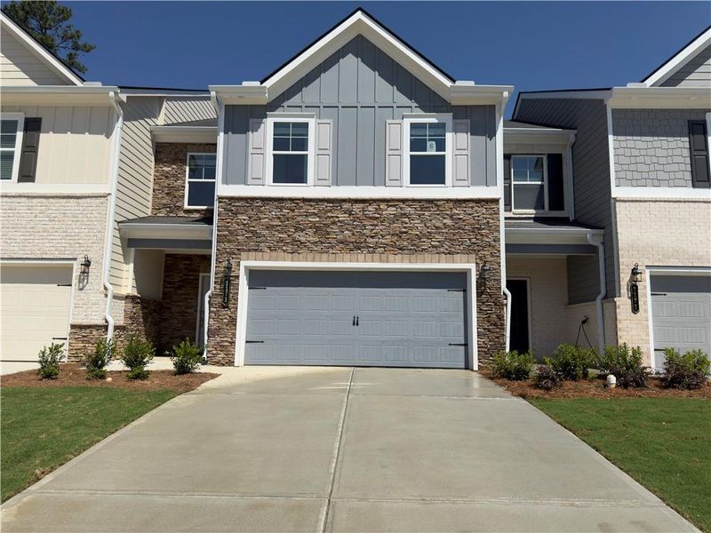 Front exterior of a new home in Park Center Pointe, Austell, GA, highlighting curb appeal (Image 2).