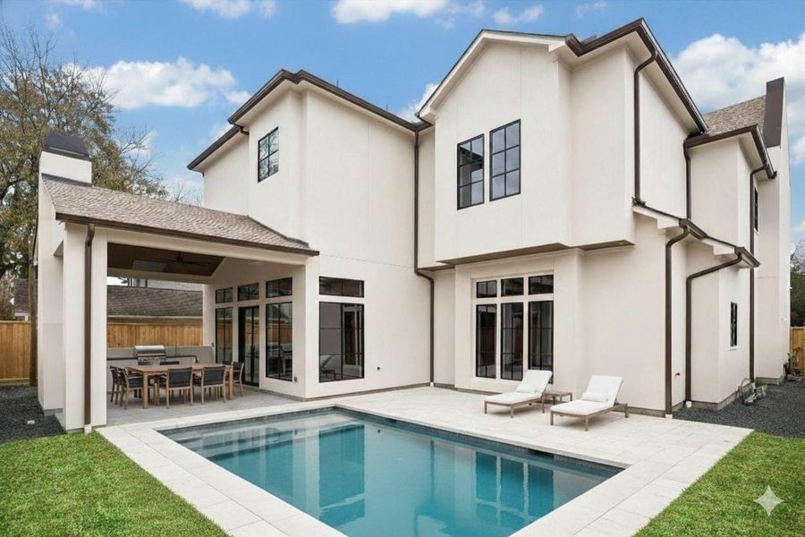 Conceptual pool rendering showcases the backyard’s potential for a custom in ground pool while maintaining generous green space and covered patio access. Expansive windows and outdoor kitchen create an ideal layout for future indoor outdoor living and entertaining possibilities. *Virtually Rendered and Staged*