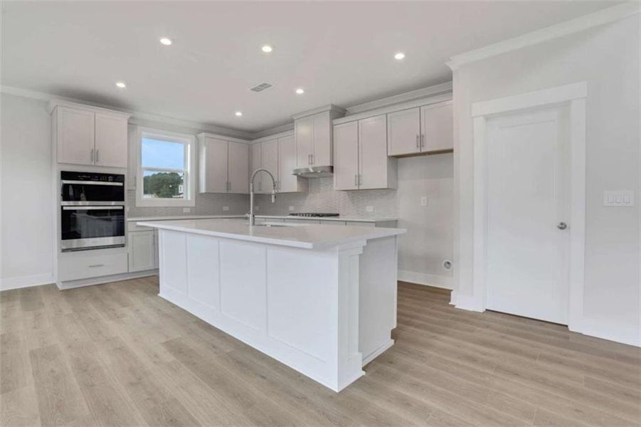 Furnished interior view inside a new home in The Paddocks at Doc Hughes, Buford (Image 11).