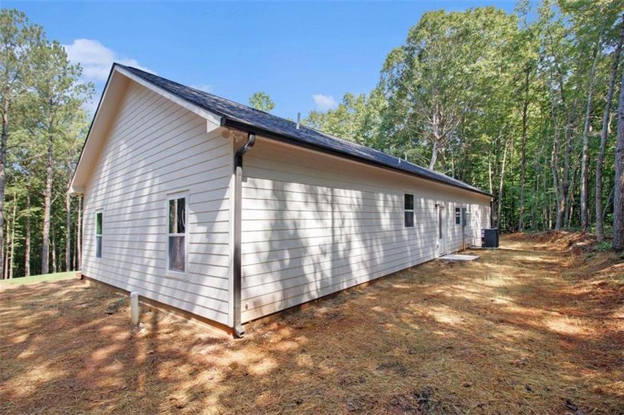 Front exterior of a new home in , Temple, GA, highlighting curb appeal (Image 19).