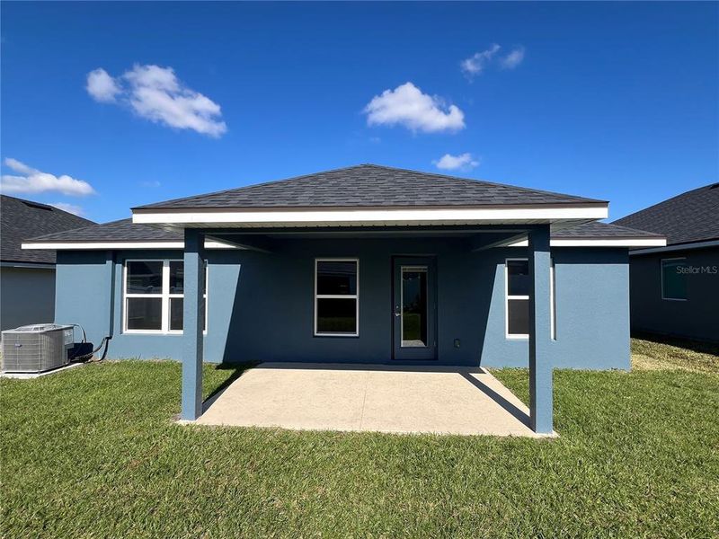 Exterior details and patio area of a home in Abbey Glen, Dade City (Image 3).