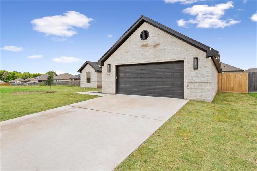 View of front of house with brick siding and driveway View of front of house with brick siding and driveway