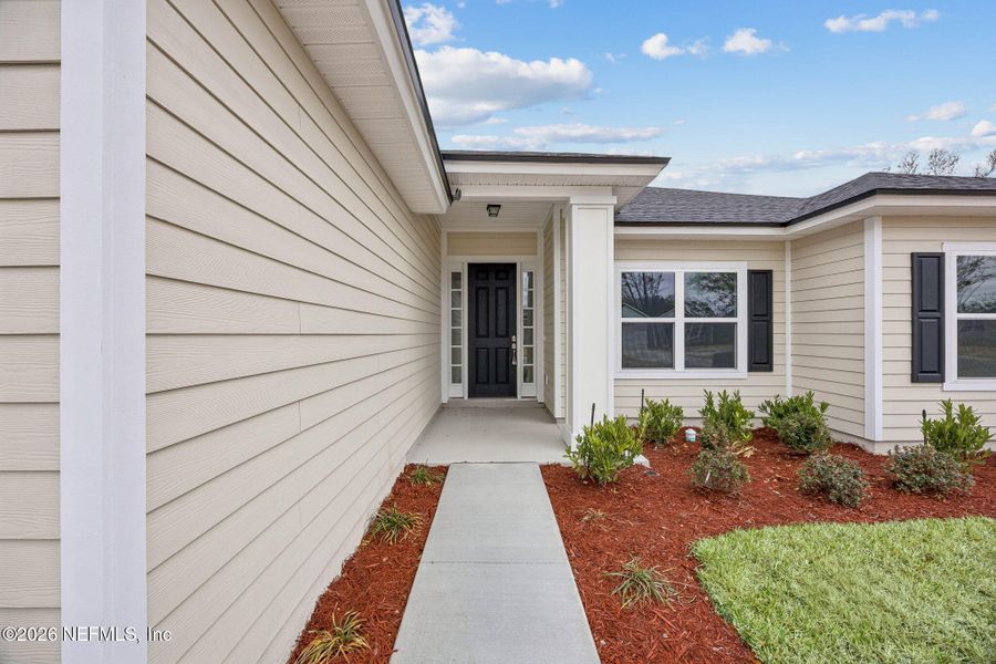 Exterior details and patio area of a home in Weston Woods, Jacksonville (Image 17).